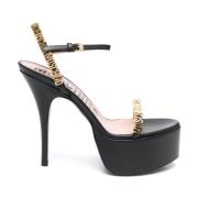 Moschino Svarta högklackade sandaler med guld logoplatta Black, Dam