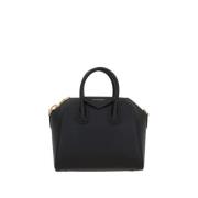 Givenchy Svart hammrad läderhandväska med guldhardware och avtagbar ke...