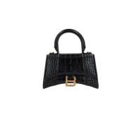 Balenciaga Svart handväska i krokodiltryckt läder med antikguld detalj...