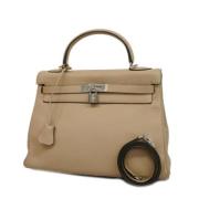 Hermès Vintage Pre-owned Tyg handvskor Beige, Dam