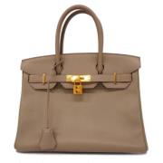 Hermès Vintage Pre-owned Laeder handvskor Beige, Dam