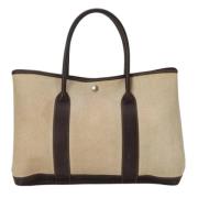 Hermès Vintage Pre-owned Canvas handvskor Beige, Dam