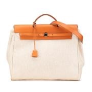 Hermès Vintage Pre-owned Canvas handvskor Beige, Dam