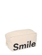 Cavita. Travel Wash Bag Cream Design Letters